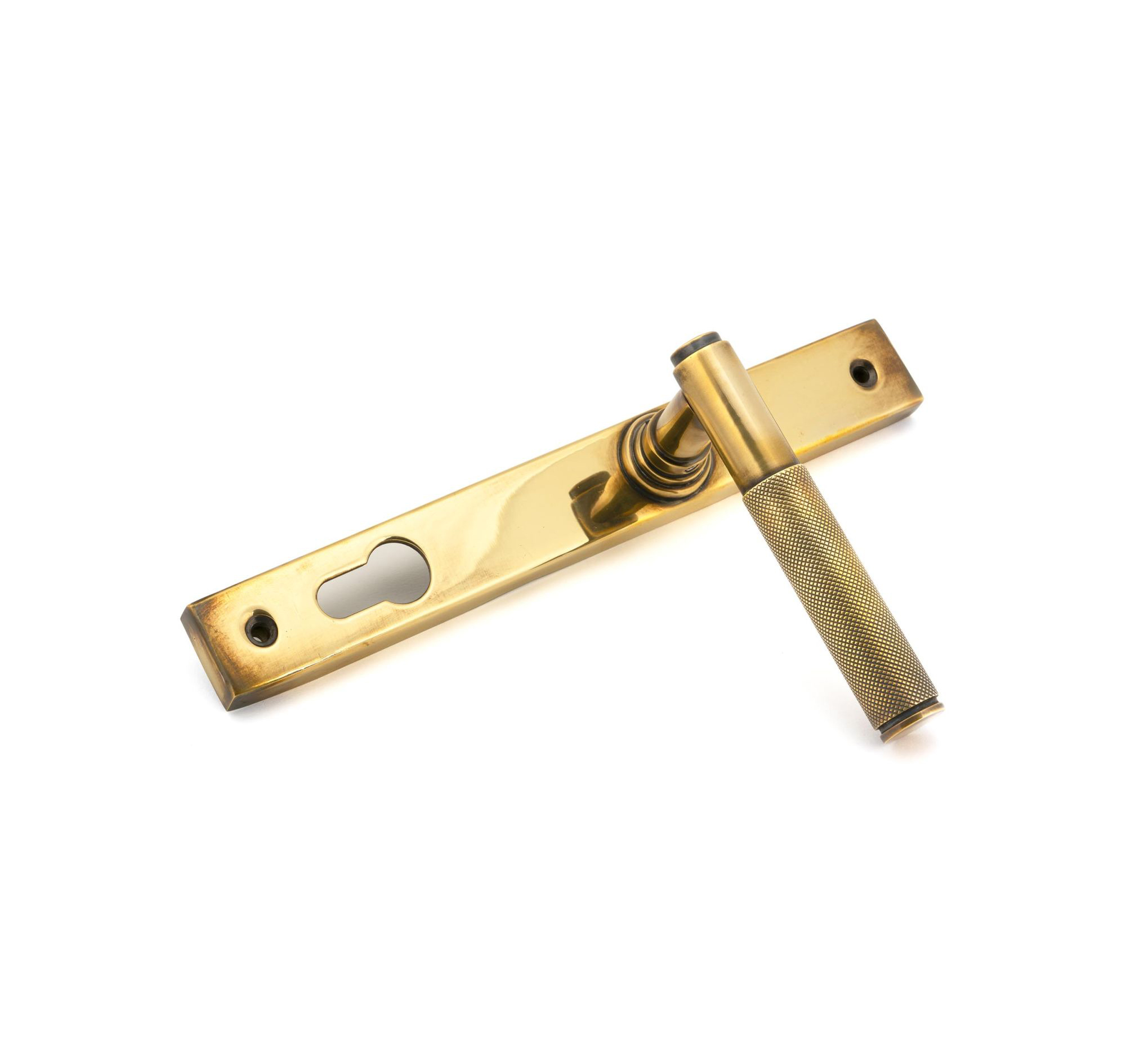 Aged brass knurled lever handle close-up